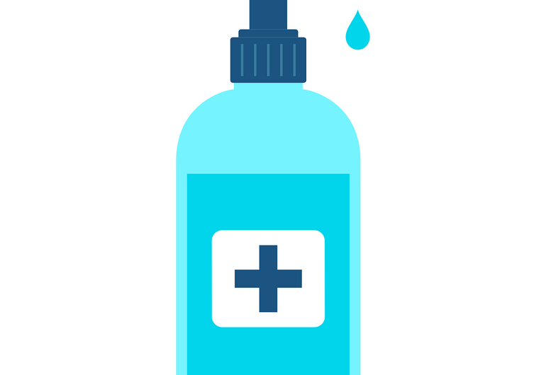 Person using hand sanitiser in the workplace
